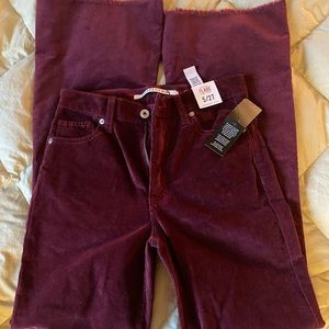 Burgundy flare raw hem jeans